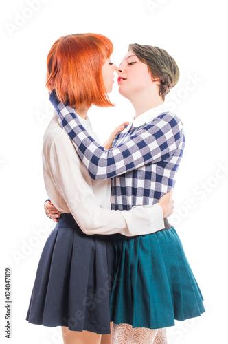 Two Lesbian Girls Hugging And Kissing On The Lips On White Isolated Background Buy This