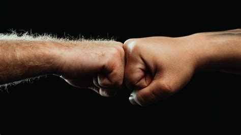 Close Up Of Two People Fist Bumping Each Other · Free Stock Photo
