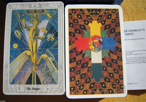 two tarot cards one in gold and the other in blue with an image of a man on it