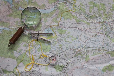 Photo Of Magnifying Glass And Ruler On Map Map Travel Compass