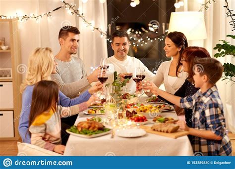 Murder mystery dinners make for a fun get together with old friends or an icebreaker to get guests talking. Happy Family Having Dinner Party At Home Stock Photo ...