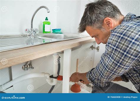 Plumber Fixing Sink Pipe In Kitchen Stock Photo Image Of Horizontal