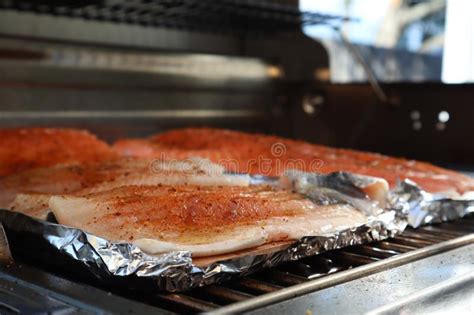 Roasting salmon fillets in the oven gives you beautiful, succulent fish that doesn't require constant attention. Grilled Salmon On The Flaming Grill. Fresh Raw Salmon Fillet On Wooden Board Wrapped In Foil ...