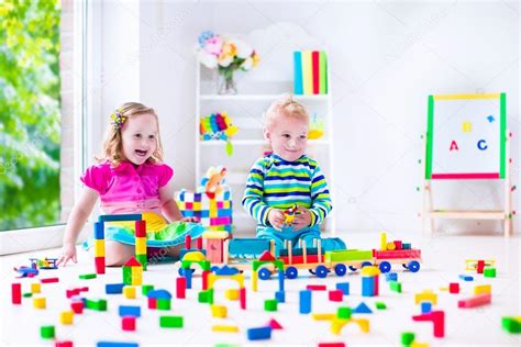 Kids Playing At Day Care With Wooden Toys — Stock Photo © Famveldman