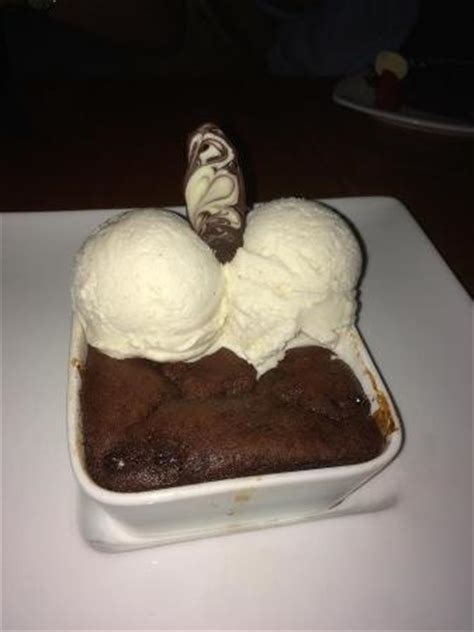 Jungle Fever Chocolate Cake On Chocolate Syrup With Vanille Ice Cream