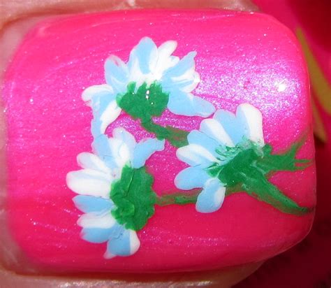 With hints of blue and red in its base colors. Pastel blue flowers on neon pink | Nail Art