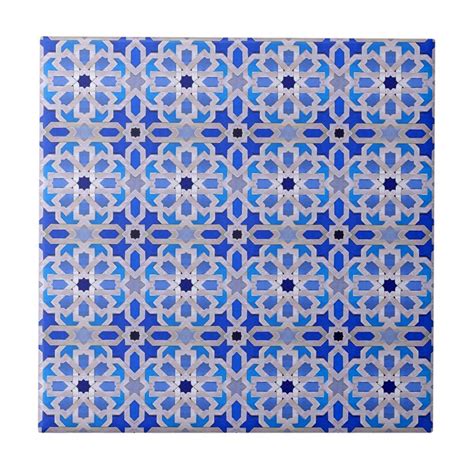 A Blue And White Tile With An Intricate Design