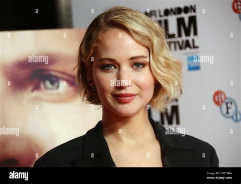 Actress Jennifer Lawrence Poses For Photographs During The Photo Call For The Film Serena As