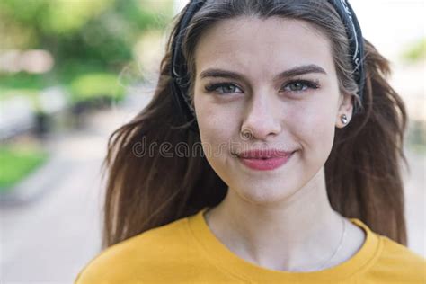 Close Up Portrait Of A Young And Attractive Caucasian Girl Who Is