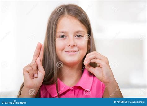 Deaf Girl Inserting Hearing Aid Royalty Free Stock Photo
