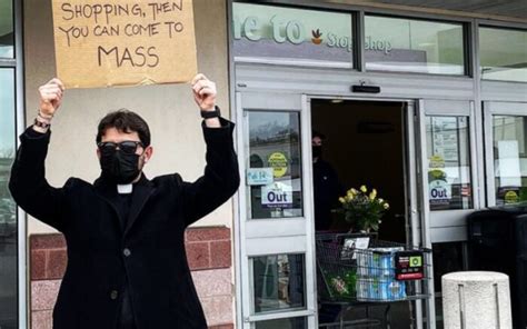 New York Priest Stands Outside Store With Sign Encouraging Mass