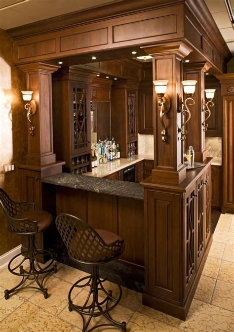 The Raised Soapstone Bar Countertop Here Stands Flanked By Carved Wood Pillars With A Pair Of