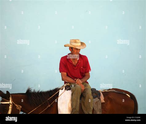 Older Man With Cowboy Hat Sitting On Horse Stock Photo Alamy