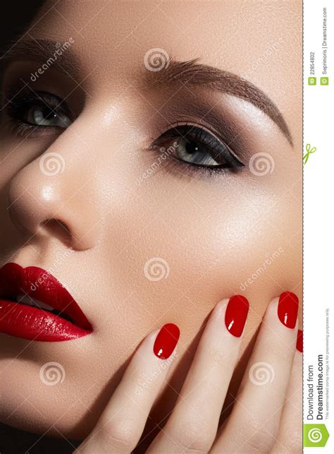 Fashion Make Up And Manicure Red Lips Nails Stock Photo