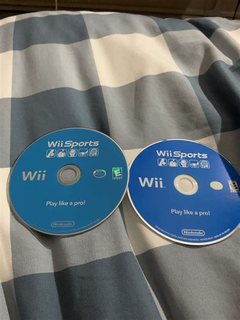 Got Two Wii Sports Discs One On The Right Is A Deeper Blue And Is More