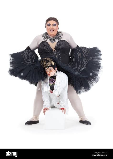 Two Drag Queens Performing Together In Humorous Caricature Of Women On