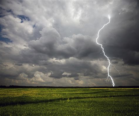 Lightning Strike On The Farmland With Stormy Clouds Image Free Stock