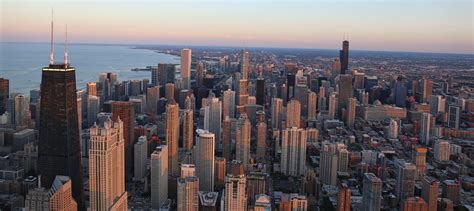 Aerial Photography Of City Building Near Ocean During Day Tim Chicago
