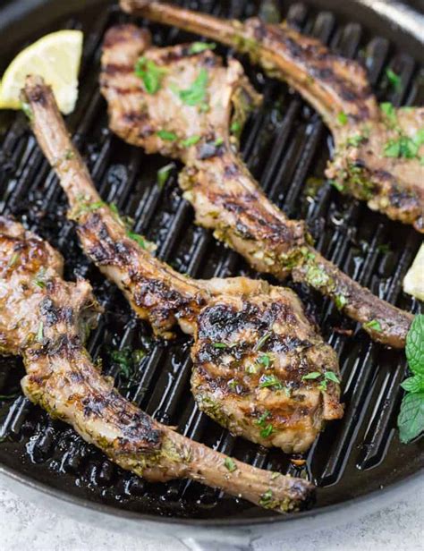 Lamb and vegetable mousseline moistens rare lamb chops, sliced to reveal the garlic clove hidden inside. Marinated Lamb Chops with Garlic and Herbs - Rachel Cooks®