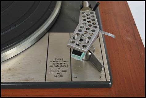 A Vintage 20th Century Lenco Goldring Record Player Deck Set Within A