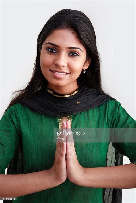 Close Up Of A Young Woman Doing Namaste High Res Stock Photo Getty Images