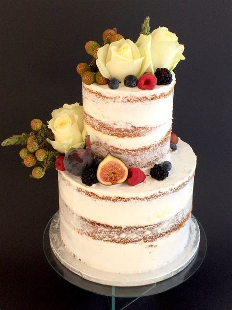 Two Tier Naked Cake With Fresh Berries And Roses