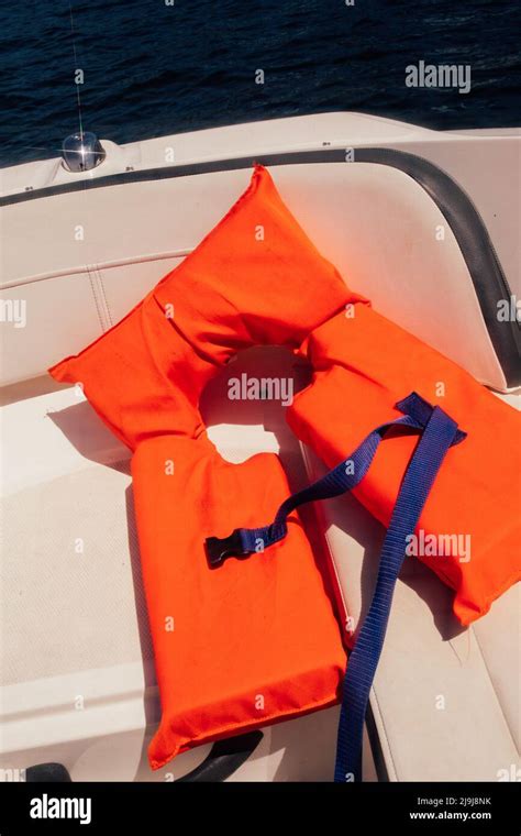 Orange Life Vest On Boat Deck Stock Photo Alamy
