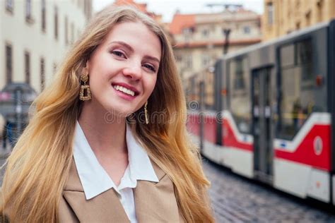 Blonde Woman Stand In Bus Stop And Waiting Trolley In Prague Sity Chezh