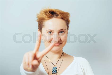 Girl Shows Two Fingers Stock Image Colourbox