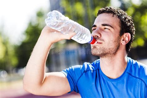 Young Handsome Man Drinking Water During A Hot Day Stock Image Image