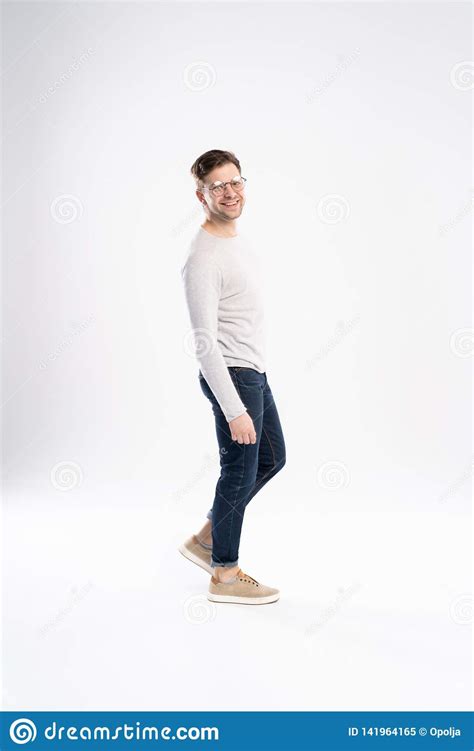 Full Body Picture Of A Smiling Casual Man Standing On White Background