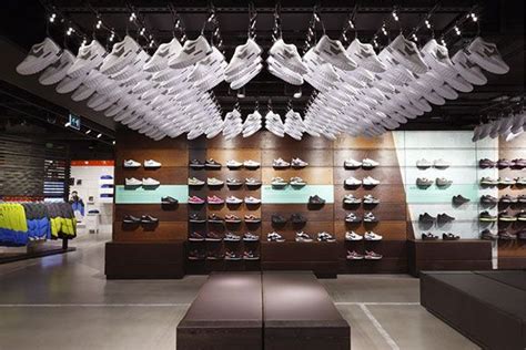 The Inside Of A Shoe Store With Lots Of Shoes Hanging From Its Ceiling