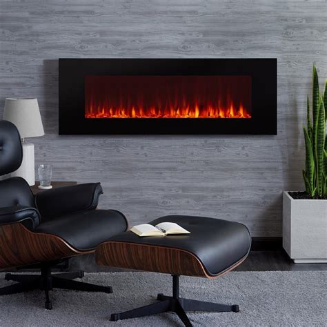 An Electric Fireplace In A Living Room With A Black Leather Chair And