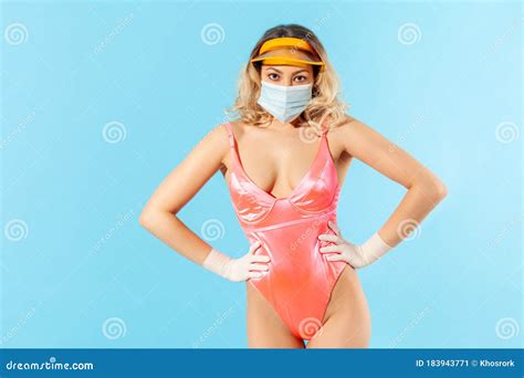 Attractive Woman In Swimsuit Wearing Hygienic Face Mask And Surgical