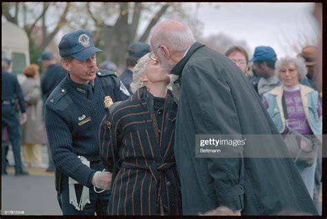Dr Benjamin Spock Kisses His Wife Mary Morgan As She Is Handcuffed