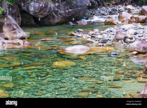 Crystal Clear River Water Flowing Over Rocks Nature Background Stock