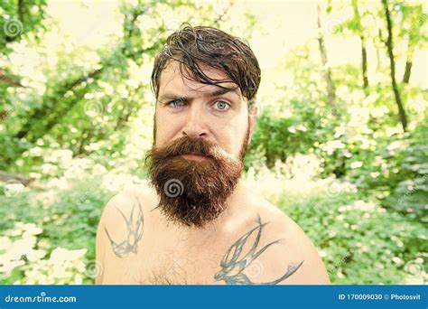 Brutal And Rugged Hairy Hipster Wearing Long Beard And Mustache In