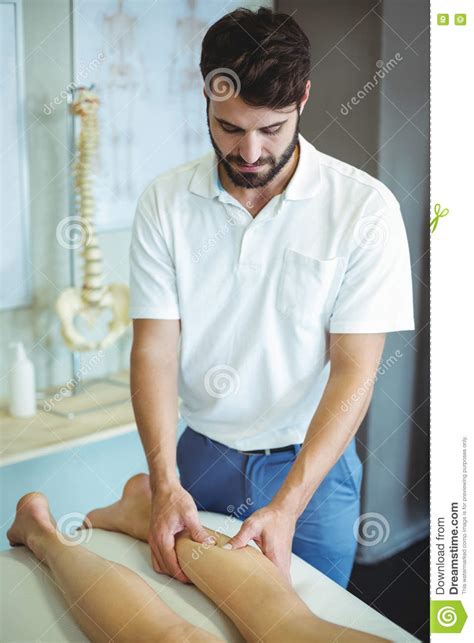 Physiotherapist Giving Leg Massage To A Woman Stock Image Image Of