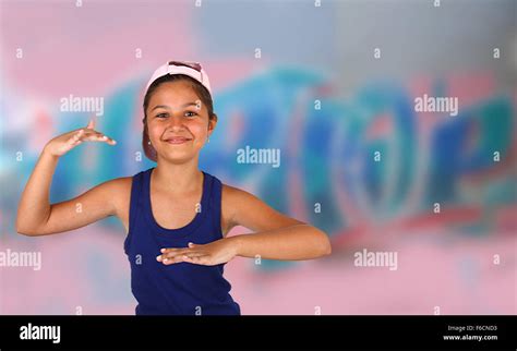 Little Girl Dancing Hip Hop Over The Wall With Murals Stock Photo Alamy