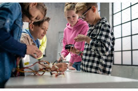 Group Of Kids Working Together On School And Education Stock Photos