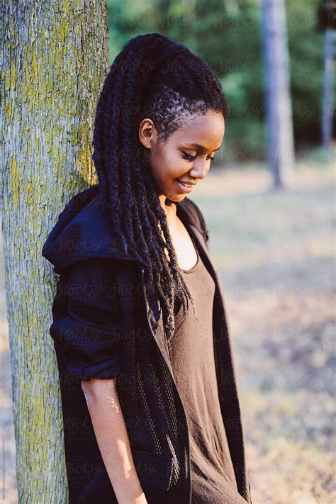 Rasta Woman With Dreadlocks Posing In The Nature At Sunset By Stocksy Contributor Vero