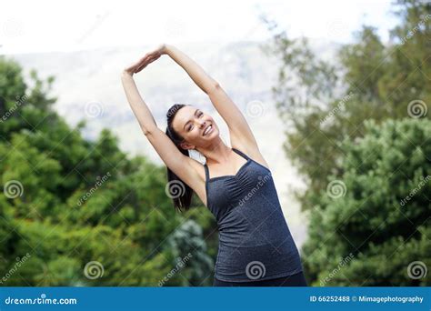 Healthy Young Woman Smiling And Stretching Outdoors Stock Photo Image