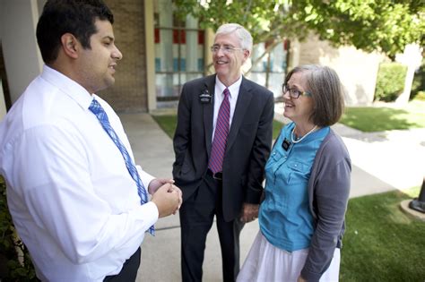 Senior Missionary Couple Talking To A Man