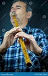 Man playing on pipe flute stock photo. Image of eyewear - 47871836