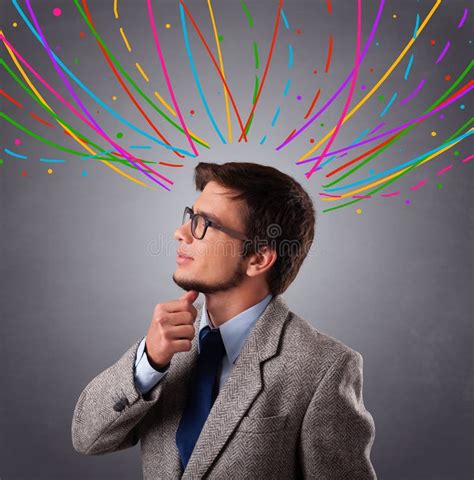 Young Man Thinking Wiht Colorful Abstract Lines Overhead Stock Photo