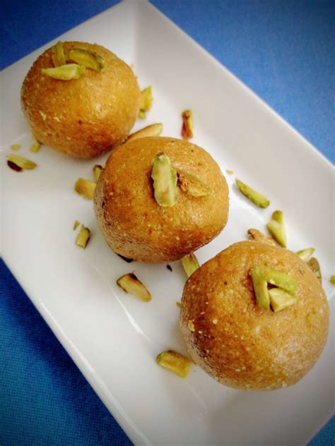 An easy and tasty north indian laddu recipe made with a fine powder of urad dal and powdered sugar. Besan Ladoo Recipe | Besan Laddu | VegeCravings