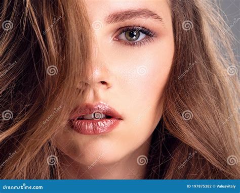 beautiful brown hair girl with long hair close up of a pretty caucasian girl with wavy hair