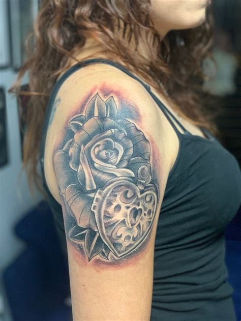 This one is a bit larger in size as it has roses along with the heart. Rose & Heart Lock | I tattoo, Tattoos, Heart lock