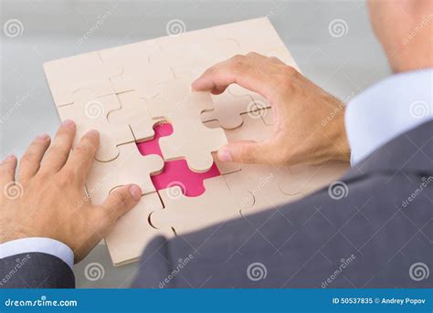 Businessman Assembling Jigsaw Puzzle Stock Image Image Of Businessmen