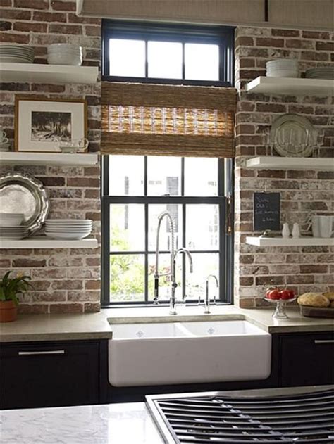 Brick wall, tall window, floating shelves, and a farm sink ...